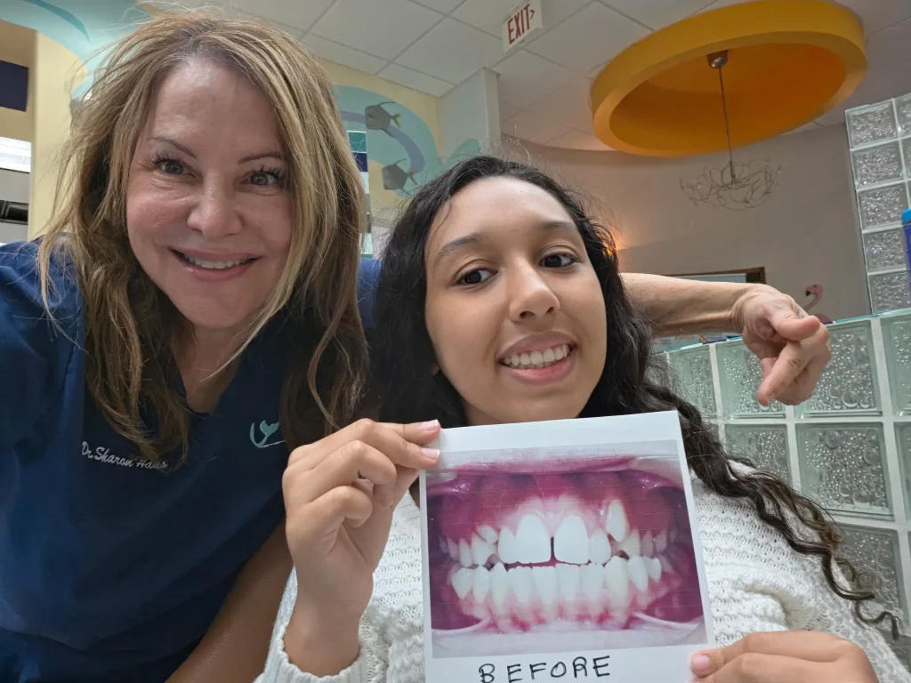 a smile with a small diastema gap between the two upper front teeth resolved by an orthodontist